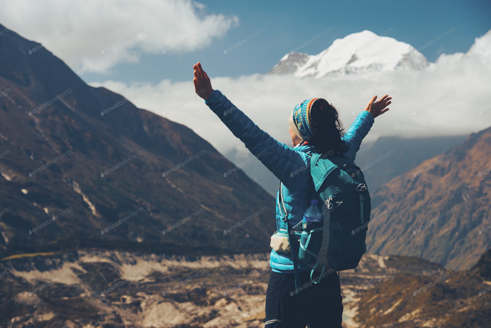 Woman with backpack and raised up arms. Vintage
