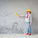ビジネスマンの真似をする子供